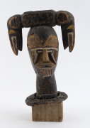 A double sided bust, carved wood and wicker with earth pigment, Ekoi tribe, Nigeria/Cameroon, on later wooden base, ​33cm high overall - 2