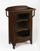 An Australian Arts and Crafts music cabinet, walnut and glass, early 20th century, 97cm high, 70cm wide, 36cm deep