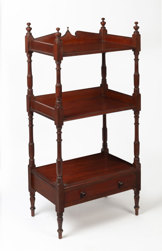 An Australian three tier wotnot with single drawer, stained kauri pine, 19th century, ​114 cm high, 55cm wide, 37cm deep