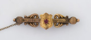 WILLIS & SONS (Melbourne), antique 9ct gold bar brooch set with red stone, 19th century, stamped "9.W" with unicorn mark, ​5.2 cm wide, 2.9 grams