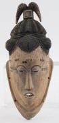 A mask with elaborate head dress and pointed teeth, carved wood and remains of polychrome finish, Guro tribe, Ivory Coast, ​43cm high - 2