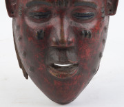 A mask with stylized top knot, carved wood with red and black painted finish, Guru tribe, Ivory Coast, ​40cm high - 3