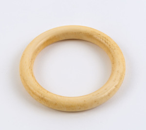 A vintage carved ivory bangle, early 20th century, formerly the property of DAME MARY COOK. 7.6cm diameter, internal measurement 5.6cm diameter. PROVENANCE: The Cook family by descent