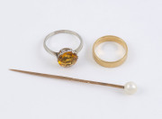 An 18ct yellow gold wedding band, together with a gold and pearl stickpin and an 18ct white gold and yellow stone ring, (3 items), formerly the property of DAME MARY COOK. 7.5 grams total. PROVENANCE: The Cook family by descent