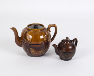 BENDIGO POTTERY fern patterned teapots, 19th century, (2 items), the larger 18cm high, 27cm wide