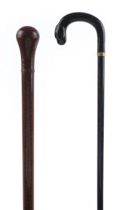 Two walking sticks, one fiddleback blackwood the other ebony and horn with gold plated collar stamped "T.H.", 19th century, 90cm and 92cm high