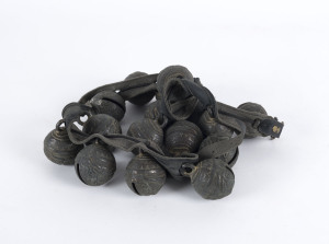 Tibetan yak bells, cast bronze and leather, 19th century, 17 bells in total, each bell 7cm high