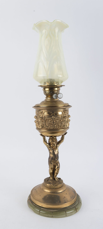 An antique banquet lamp, gilt bronze cherub column on green onyx base with white button double burner and yellow vaseline glass shade, 19th century, 78cm high