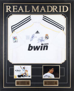 REAL MADRID: Real Madrid home shirt signed by Cristiano Ronaldo & Kaka, window mounted with photographs of each footballer, framed & glazed, overall 90x111cm. With CoA.