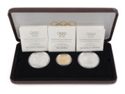 GOLD - world : FRANCE: 1896-1996 Olympics Centenary three-coin presentation set comprising 22k gold 500fr coin weight 16.97g, plus two sterling silver 100fr coins, each weighing 33.63gr, in original presentation case with box; Unc.