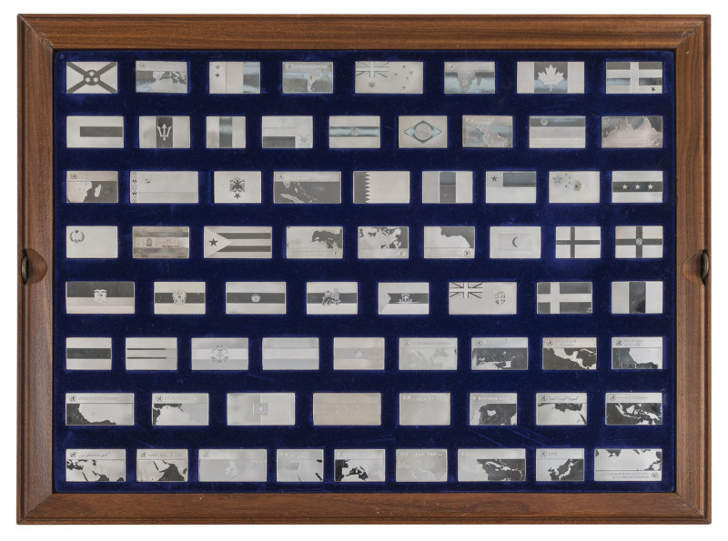 Medallions & Badges : STERLING SILVER - "THE FLAGS OF THE UNITED NATIONS INGOT COLLECTION": complete set of 135 proof ingots issued by Franklin Mint (1974) housed in two velvet-lined frames which fit into a wooden cabinet; mintage 7731, issue price US$128