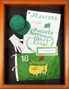 NICK FALDO, display comprising signed golf flag, cap, towel & glove (glove with fading), framed & glazed, overall 86x108cm; also print "Par 3 17th, Royal Troon Golf Club" signed by Justin Leonard. (2 items).