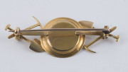 A rare Australian gold miner's brooch, gold pan with nuggets flanked by picks and shovels on each shoulder, housed in a period box marked "HENRY F. HUTTON WATCHMAKER & JEWELLER, STURT STREET BALLARAT", 19th century, rare. 5.5cm wide, 4.5 grams - 2