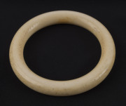 A vintage carved ivory bangle, early 20th century, formerly the property of DAME MARY COOK. 7.6cm diameter, internal measurement 5.6cm diameter. PROVENANCE: The Cook family by descent - 2