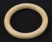 A vintage carved ivory bangle, early 20th century, formerly the property of DAME MARY COOK. 7.6cm diameter, internal measurement 5.6cm diameter. PROVENANCE: The Cook family by descent - 3