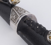 A fine Scottish dirk with carved ebony handles set with impressive citrines, in original plush fitted leather case. Formerly the property of George Gibb the brother of Rev. James Gibb (1857–1935). 50cm long - 11