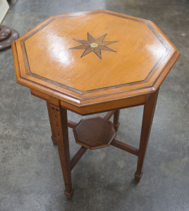 An Australian occasional table, octagonal top, kauri pine, blackwood, ebony and walnut, early 20th century, 73cm high, 61cm wide, 61cm deep