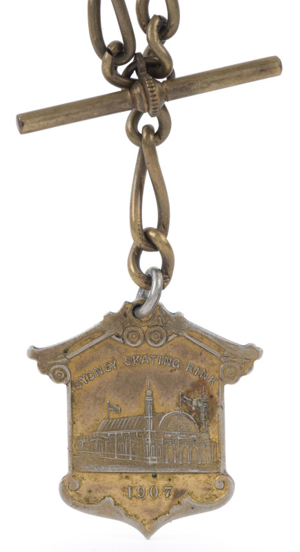 ICE SKATING: SYDNEY SKATING RINK 1907 "Admission Ticket No.520" gilt metal fob on a linked chain. The Sydney Glaciarium was opened to the public on the afternoon of 25 July 1907 in front of an estimated 2000 spectators. It was the first indoor skating rin