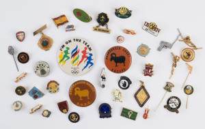 An accumulation of sports related badges, fobs and pins. (40+ items).