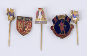 MELBOURNE FOOTBALL CLUB: A 1967 "The Demons" brass badge; a 1950s "MELBOURNE SUPPORTERS' CLUB" brass & enamel badge; and 3 Melbourne Demons pins. (5 items).