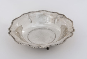 A German silver circular shaped bowl with gadrooned rim and raised on three paw feet, 20th century, ​19cm diameter, 155 grams.