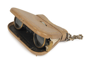 A pair of French folding opera glasses in the form of a purse, mother of pearl and leather with fine gilt tooling, circa 1875, signed "La Mignonne", 11cm wide