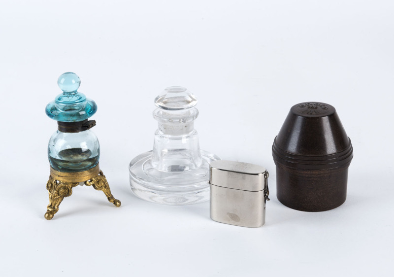 A small collection of inkwells comprising a bakelite "Onoto the Ink" sealable bottle carrier, a plated metal travelling inkwell with original glass interior, a European turquoise glass and brass inkwell and a glass inkwell with stopper. (4 items).