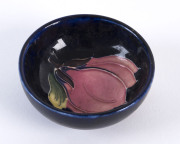 MOORCROFT "Magnolia" pattern dish on blue ground, circa 1950, 8.5cm diameter