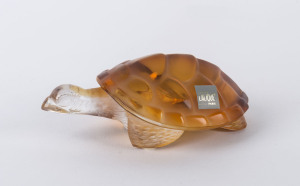 LALIQUE Amber crystal Caroline Tortoise paperweight, circa 1960s, engraved "Lalique, France" with original box and labels "Crystal Lalique France", 15cm long