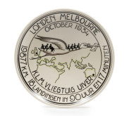 THE LONDON to MELBOURNE, MacROBERTSON CENTENARY AIR RACE 1934Porcelain hanging plaque by Koninklyk Goedewaagen Gouda (and numbered "183" on reverse), 18.5cm diameter; depicting a stork (Uiver in Dutch) carrying passengers and mail over the route from Lond