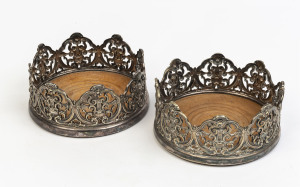 A pair of silver plated magnum sized wine bottle coasters, 19th century,