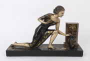A French Art Deco statue of Ruth by the font, gilt metal and marble, circa 1930s, 33cm high, 49cm wide