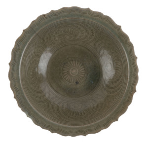 A Thai celadon lobed bowl with sgraffito decoration, 16th/17th century, 9cm high, 28cm wide
