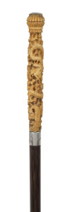 A Chinese walking stick, carved ivory handle with dragon motif, silvered collar, palm wood shaft and brass ferrule, 19th century, 86cm high