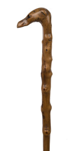 An antique walking stick, carved dog's head handle and shaft made from a single piece of blackthorn, 19th century, ​84cm high