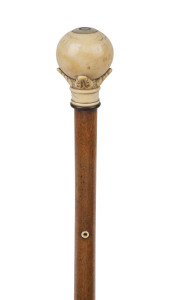 An antique walking stick with carved ivory handle, timber shaft and brass ferrule, 19th century, 88cm high