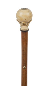 An antique walking stick with carved ivory handle, timber shaft and brass ferrule, 19th century, ​88cm high