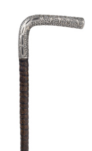 An antique walking stick, sterling silver handle engraved "W.H.G. 1917", cane shaft and brass ferrule, early 20th century, 89cm high