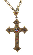 A stunning Greek Orthodox crucifix on chain, silver with remains of gilt finish, decorated with enamel cartouche of Christ and encrusted with numerous semi-precious cabochon stones. Reliquary door on the reverse, 19th century. With a Klepner's insurance v