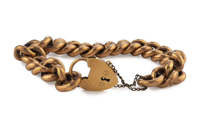 An antique rose gold curb link bracelet with heart lock, each link stamped "9c", the lock stamped "15" with anchor and pictorial mark, 19th century. ​25 grams total