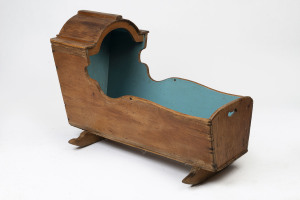 An antique cradle, painted pine, Northern European origin, 19th century, 70cm high, 95cm wide, 47cm deep