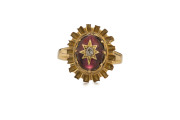 An antique 15ct yellow gold ring set with a large cabochon garnet adorned with a central diamond set in gold star, 19th century, - 2