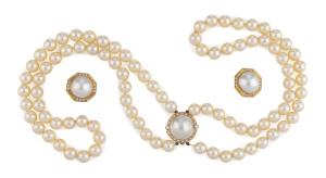 An impressive double strand pearl (8mm) choker necklace with large 18ct yellow gold clasp set with diamond, 20th century, 43cm long; together with the matching earrings.