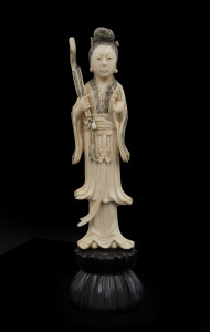 A Chinese carved ivory statue of a woman on carved wooden base, 19th/20th century, ​17.5cm high