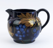 ROYAL STANLEY WARE "Jacobean" English Art Deco pottery jug with grape motif, circa 1920s, black factory mark to base, 13cm high, 17cm wide