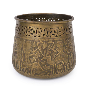 An antique Egyptian pot, pierced brass with repoussé decoration, 19th century, 19cm high, 22cm wide