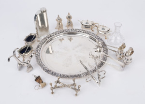 Silver plated tray, condiments, sugar tongs, knife rest, bottle stoppers, hip flask and sterling silver topped crystal bottle, (17 items), the tray 29cm diameter