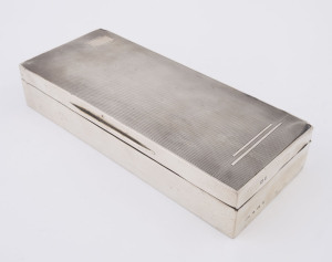 An English Art Deco sterling silver cigarette box, circa 1930s, 21.5cm wide