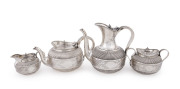 An exceptional Aesthetic Movement English sterling silver four piece tea and coffee service, finely engraved with Japanese inspired decoration, made by Richard Martin & Ebenezer Hall of London, circa 1882. Diamond pattern registration mark for 1875, the t
