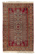 A Persian hand-knotted wool rug on red ground, mid 20th century, ​210 x 132cm